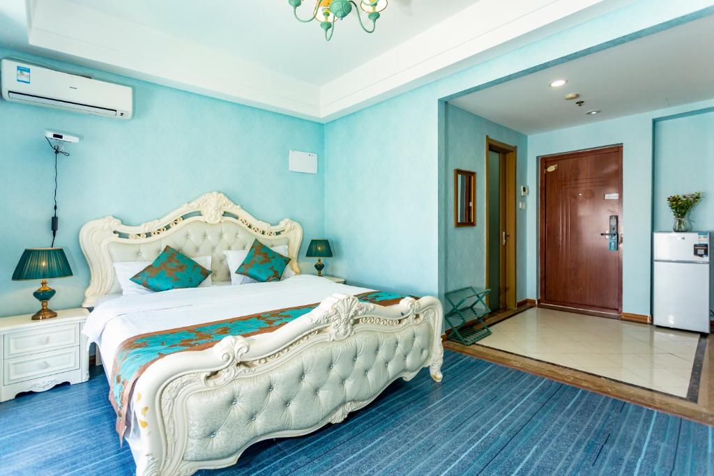 Kuchyň nebo kuchyňský kout v ubytování Dalian Hong Xi Yuan Apartment Wanda Plaza