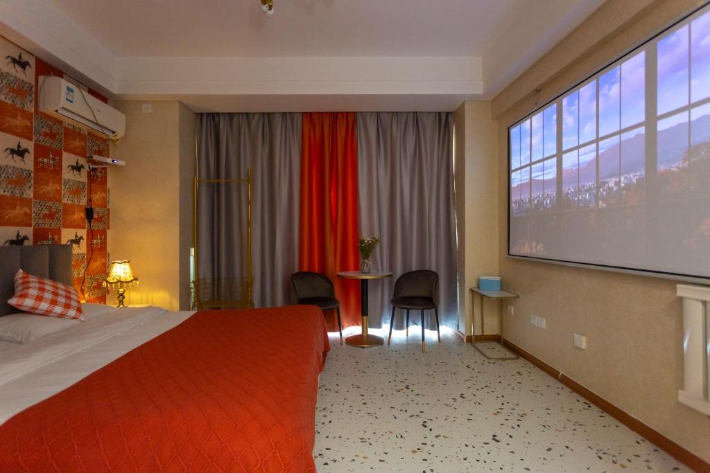 Postel nebo postele na pokoji v ubytování Dalian Hong Xi Yuan Apartment Wanda Plaza