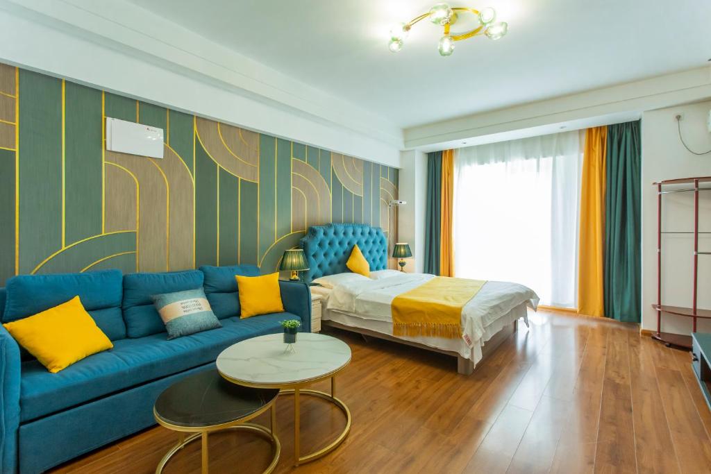 Posezení v ubytování Dalian Hong Xi Yuan Apartment Wanda Plaza