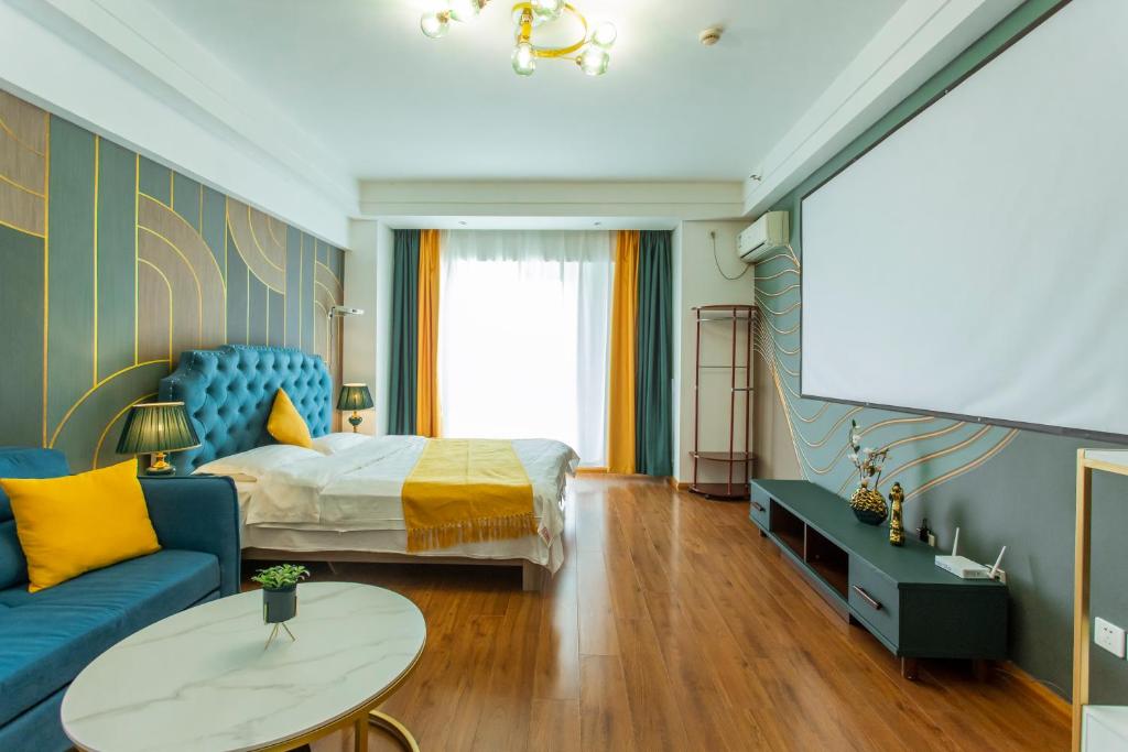 Postel nebo postele na pokoji v ubytování Dalian Hong Xi Yuan Apartment Wanda Plaza
