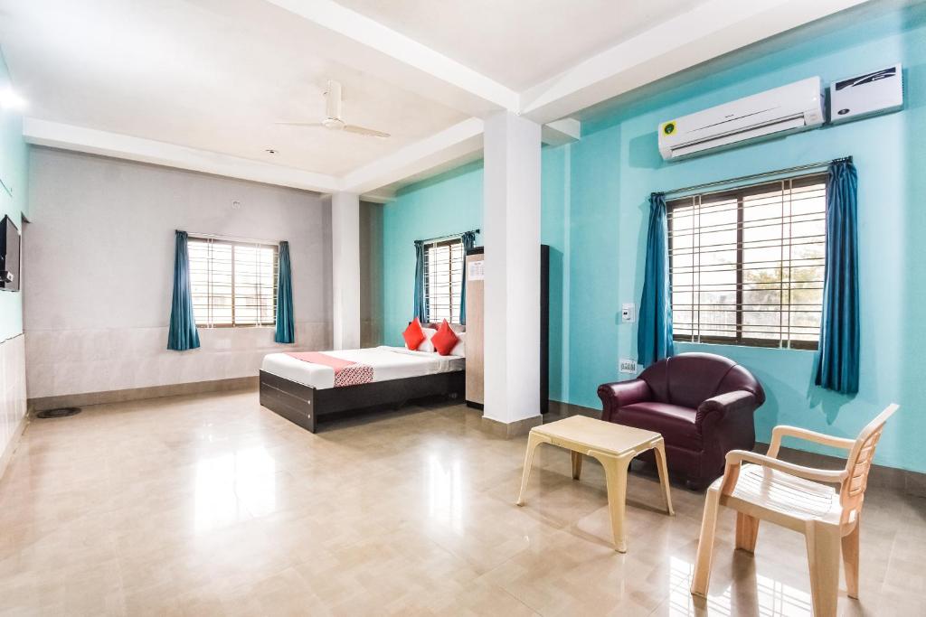 Postel nebo postele na pokoji v ubytování Hotel O Tm Delights