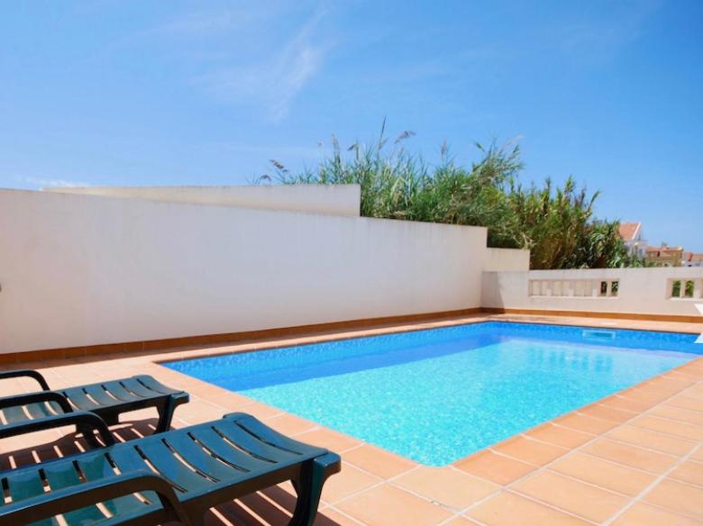 a swimming pool with two chairs next to at Sea Avenue House - center Baleal - walk to surf in Ferrel