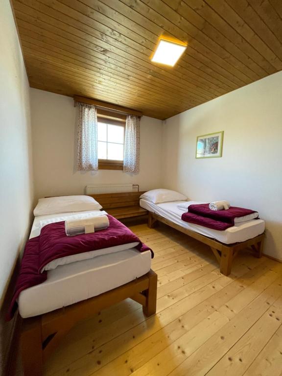 Postel nebo postele na pokoji v ubytování Resort Drevenice Terchova