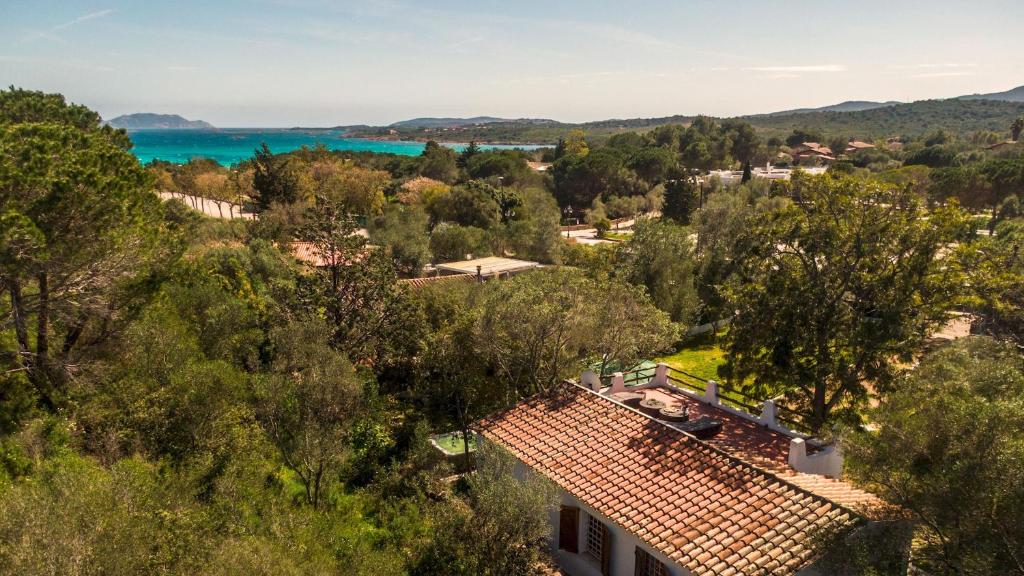 an aerial view of a town with trees and the ocean at Casa Valentina 6 Emma Villas in Porto Istana