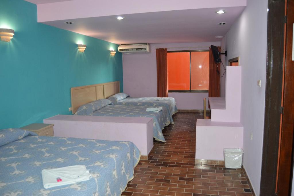 Postel nebo postele na pokoji v ubytování Hotel Tamuin