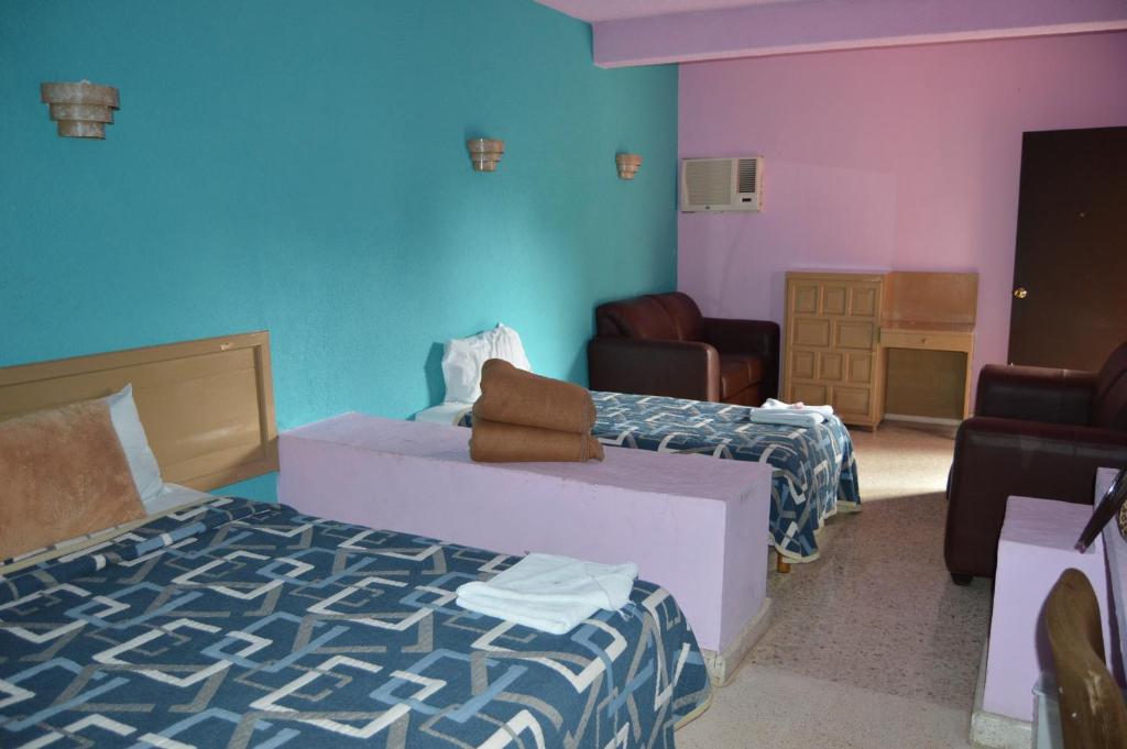 Postel nebo postele na pokoji v ubytování Hotel Tamuin