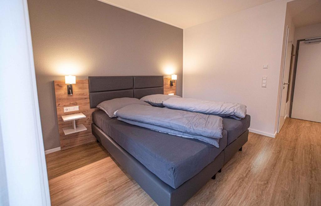 Postel nebo postele na pokoji v ubytování Boardinghouse Lingen