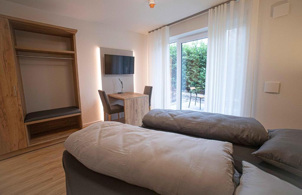 Postel nebo postele na pokoji v ubytování Boardinghouse Lingen