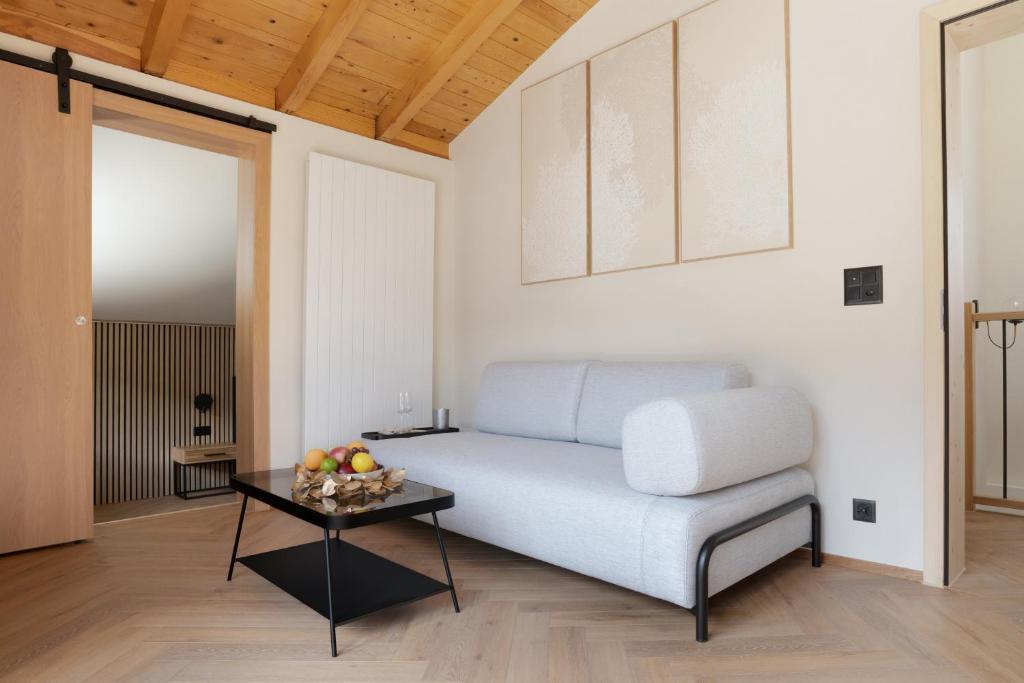 a living room with a couch and a table at Hotel Central in Engelberg