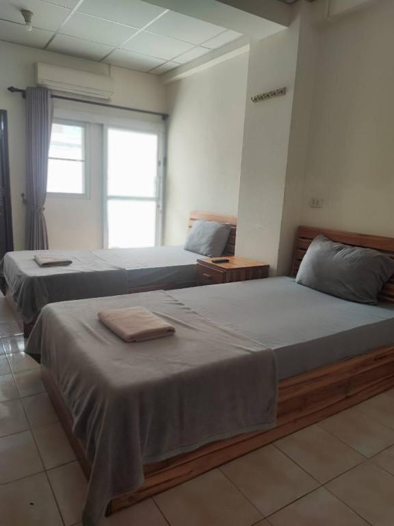 Postel nebo postele na pokoji v ubytování Soi 5 Apartment