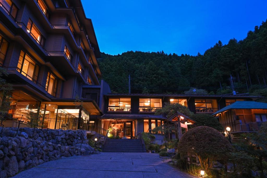 a building with a staircase in front of it at night at taishoukaku in Hanno