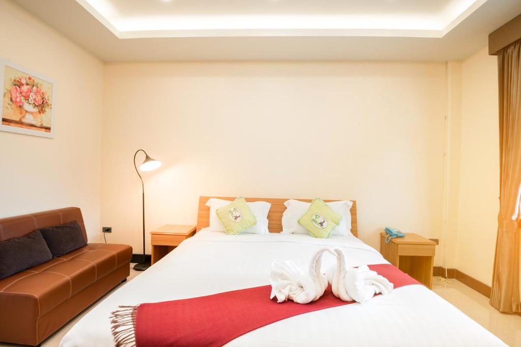 Postel nebo postele na pokoji v ubytování AU Place Hotel