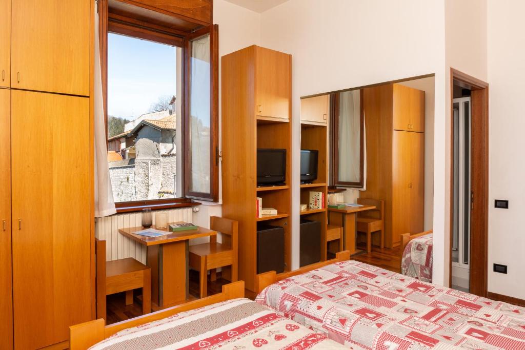 Postel nebo postele na pokoji v ubytování Albergo Sacro Monte Varese