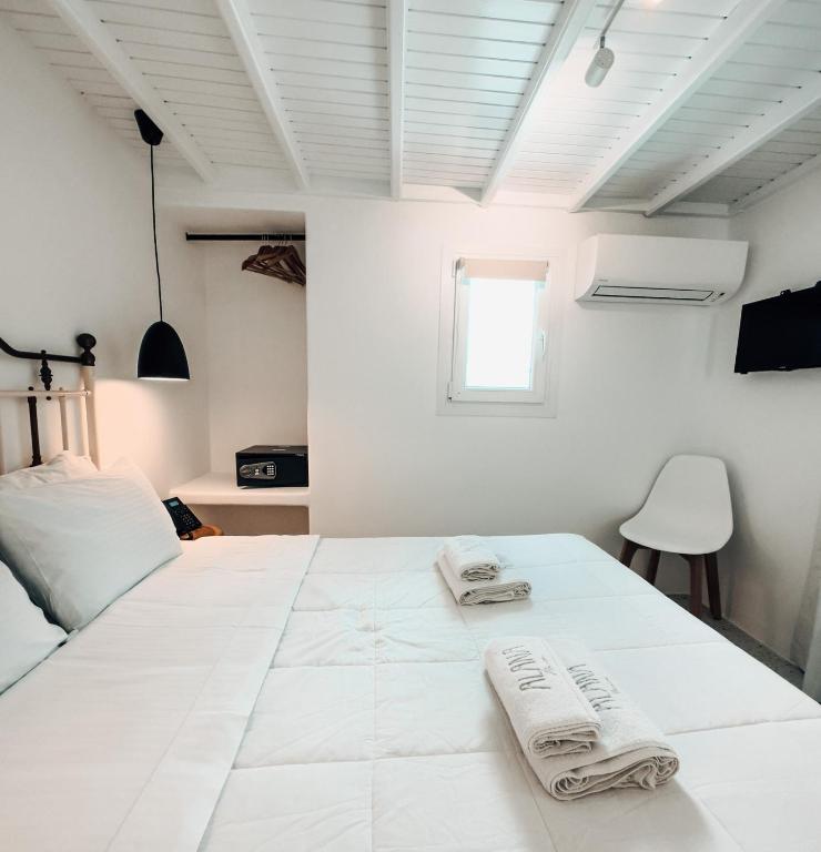 Postel nebo postele na pokoji v ubytování Alana Mykonos