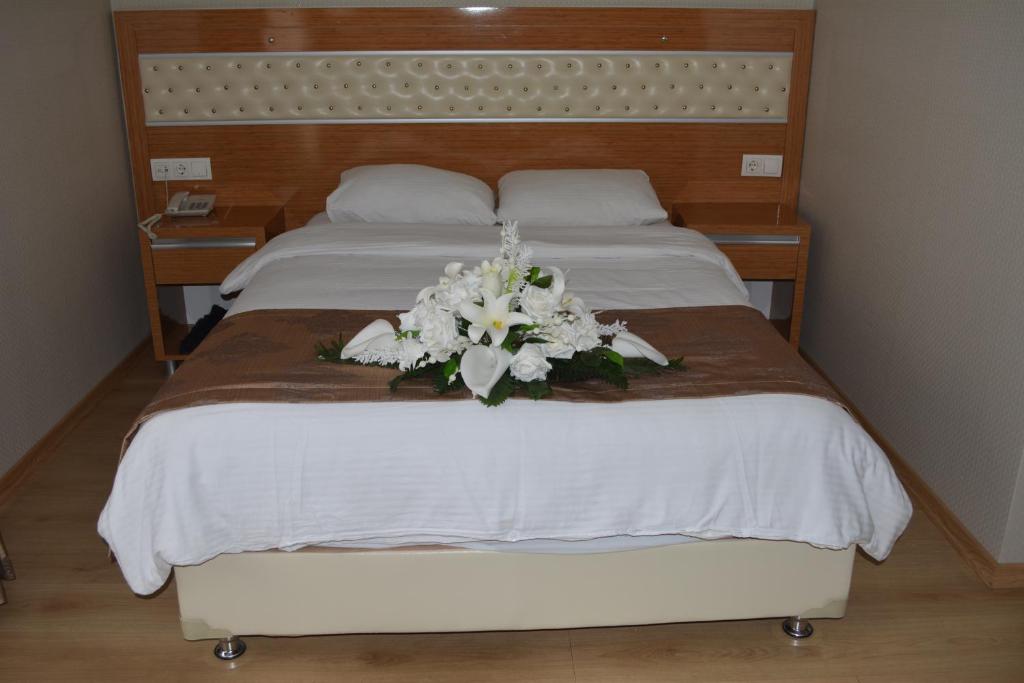 Postel nebo postele na pokoji v ubytování Serenti Pamuk Hotel