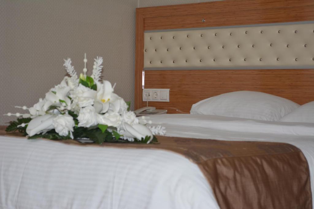 Postel nebo postele na pokoji v ubytování Serenti Pamuk Hotel