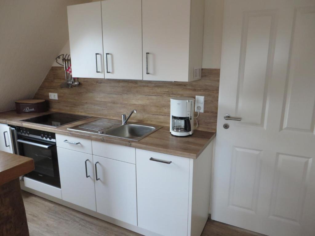 Η κουζίνα ή μικρή κουζίνα στο !!!NEU!!! Nordsee-Ferienwohnung Ahrendt