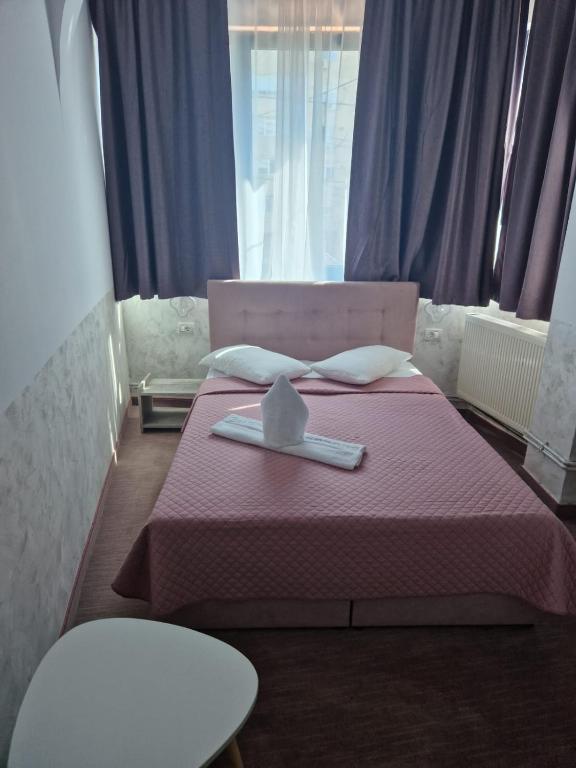 Postel nebo postele na pokoji v ubytování Hotel Minion