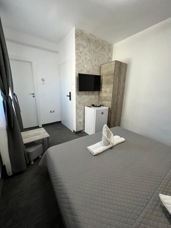 Postel nebo postele na pokoji v ubytování Hotel Minion