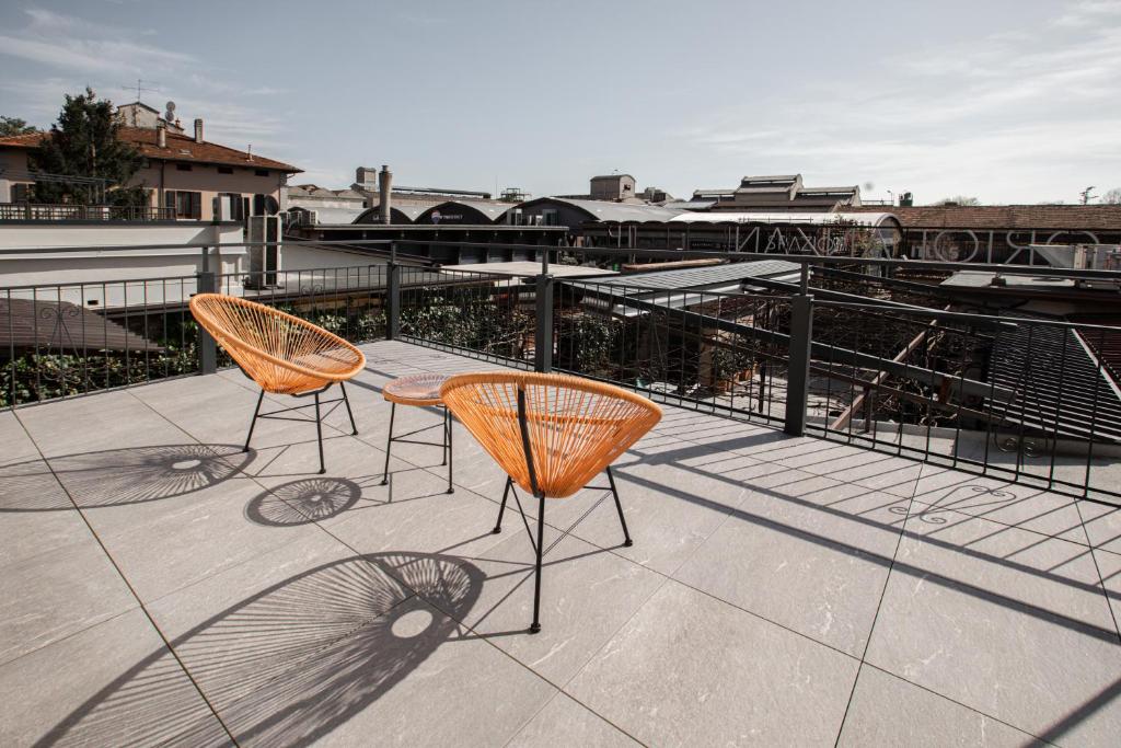 two chairs and a table on a roof at Ah Villaglori Boutique Apartments in Brescia