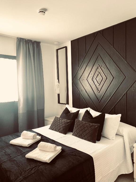 Posteľ alebo postele v izbe v ubytovaní Hostal Alisol Boutique San Pedro