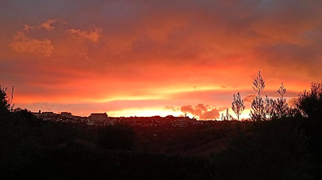 The sunrise or sunset as seen from a panziókat or nearby