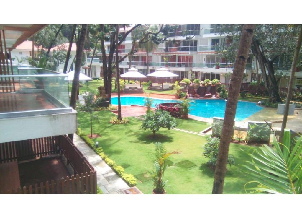 Бассейн в Aarju Luxurious Stay Calangute или поблизости