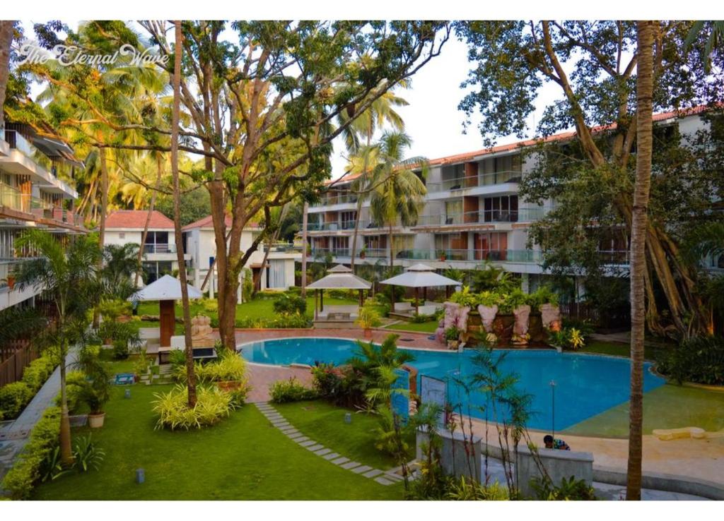 an aerial view of a resort with a swimming pool at Aarju Luxurious Stay Calangute in Calangute