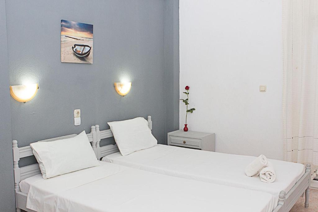 Postel nebo postele na pokoji v ubytování La Pensione Skiathos