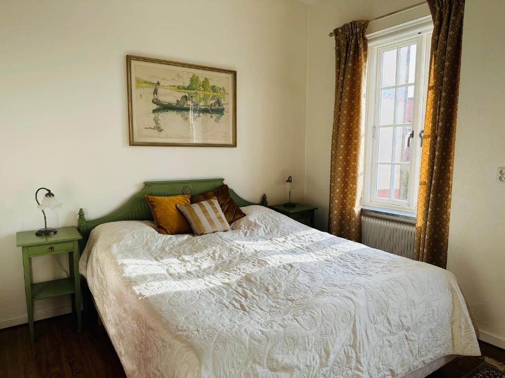 Postel nebo postele na pokoji v ubytování Köpmansgården Bed & Breakfast