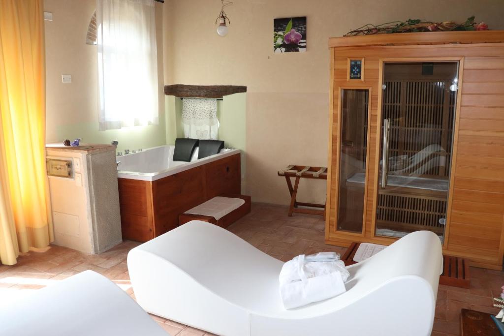Postel nebo postele na pokoji v ubytování Hotel Relais Palazzo di Luglio
