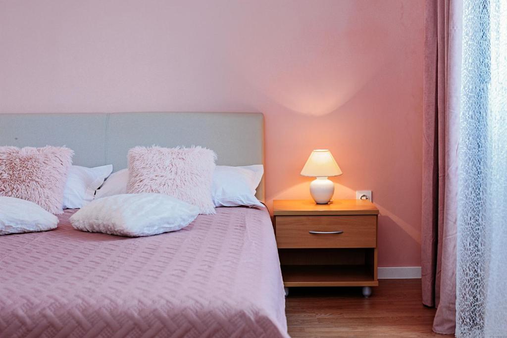 Postel nebo postele na pokoji v ubytování Rooms Emilija