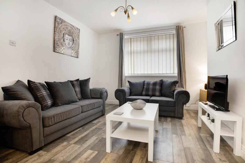 a living room with a couch and a table at Freshly Renovated, Feels Like Home, Sleeps 3 in Chester-le-Street