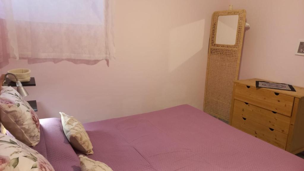 A bed or beds in a room at Delizia Caprese