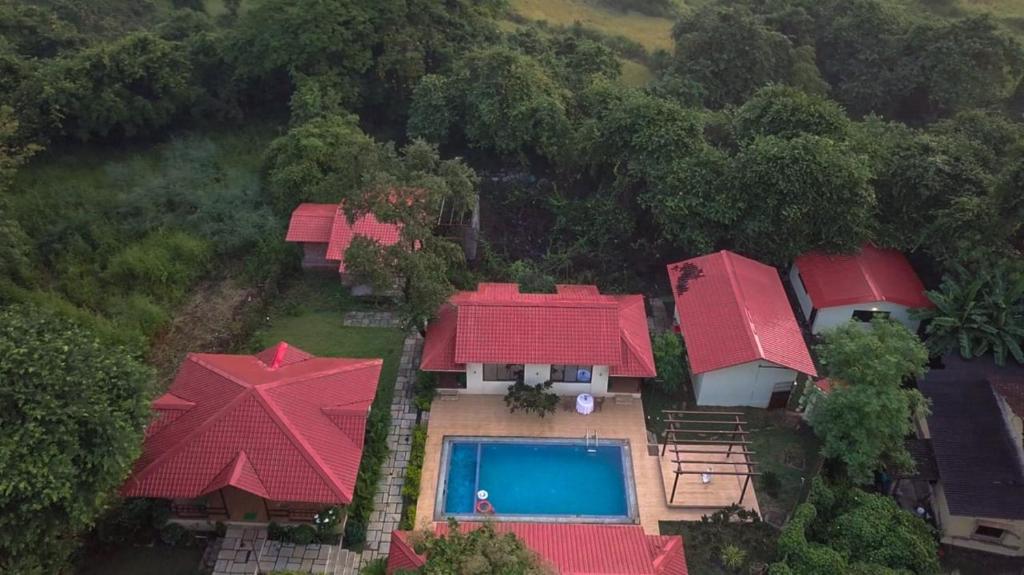 an aerial view of a house with red roofs at Tiara Resort Mandwa in Alibaug