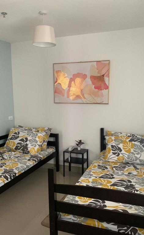 Postel nebo postele na pokoji v ubytování Cebu Mini Hotel
