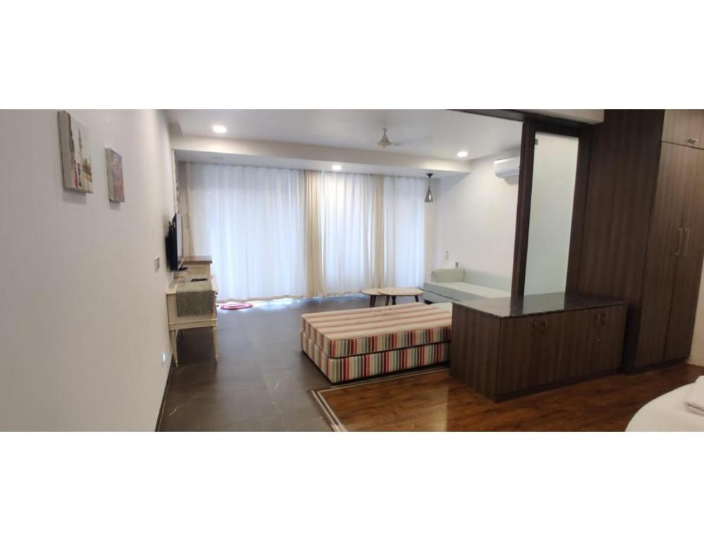 Кровать или кровати в номере Aarju Luxurious Stay Calangute
