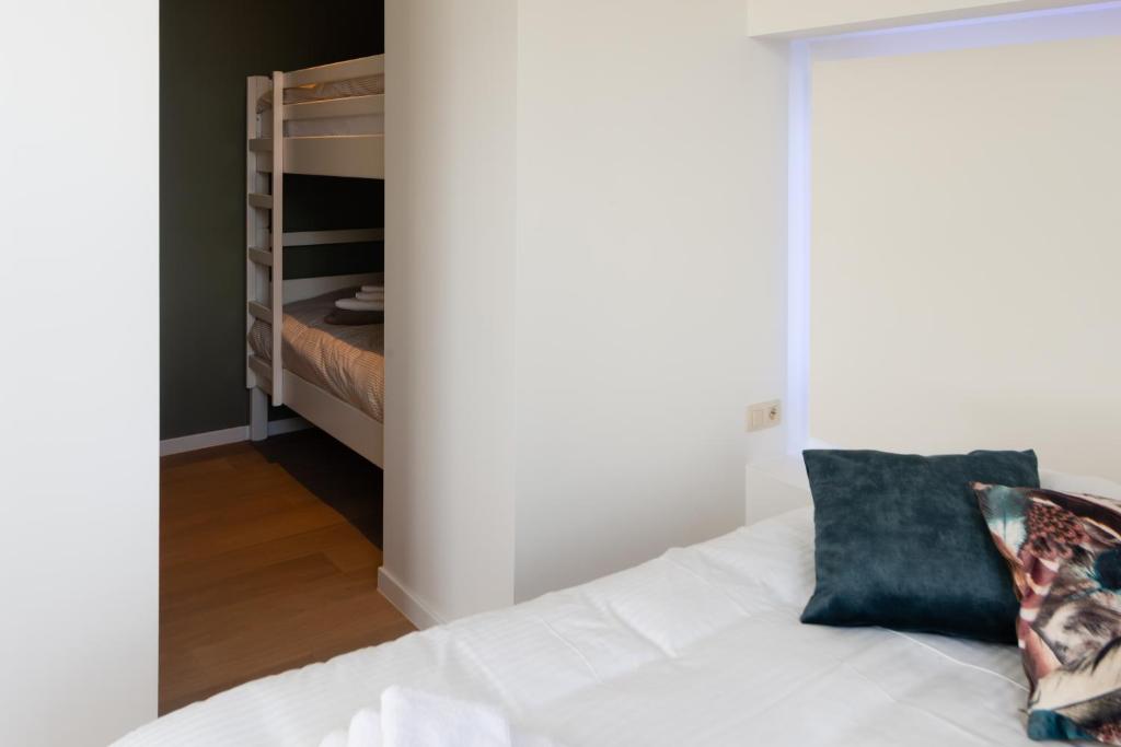 Postel nebo postele na pokoji v ubytování Boeckhaege vakantiewoning