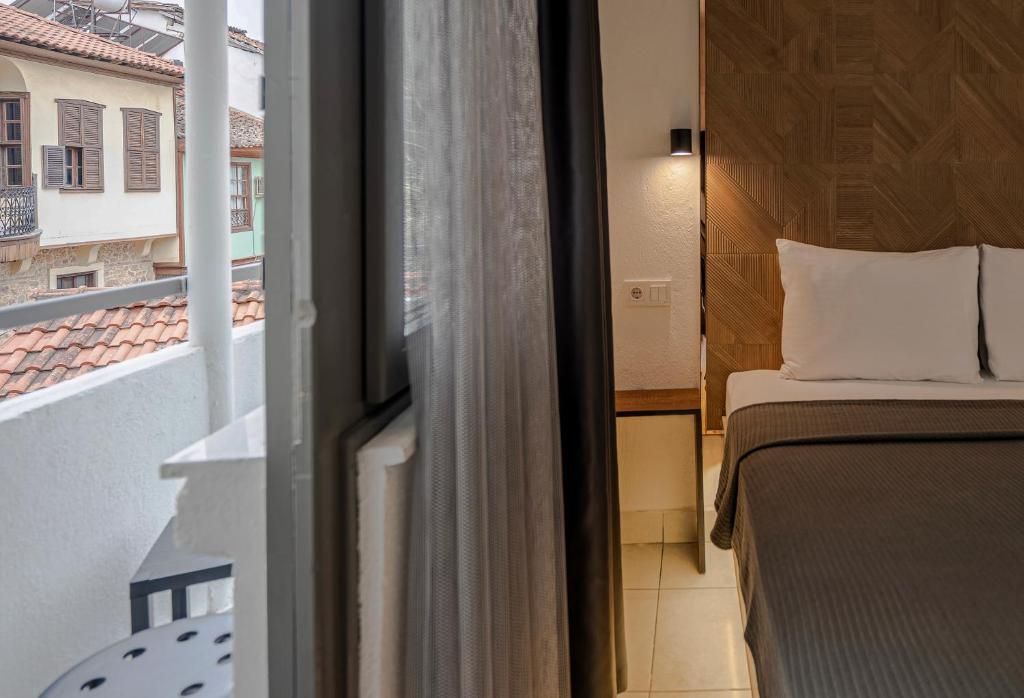 Postel nebo postele na pokoji v ubytování The Easy Rooms Verandah