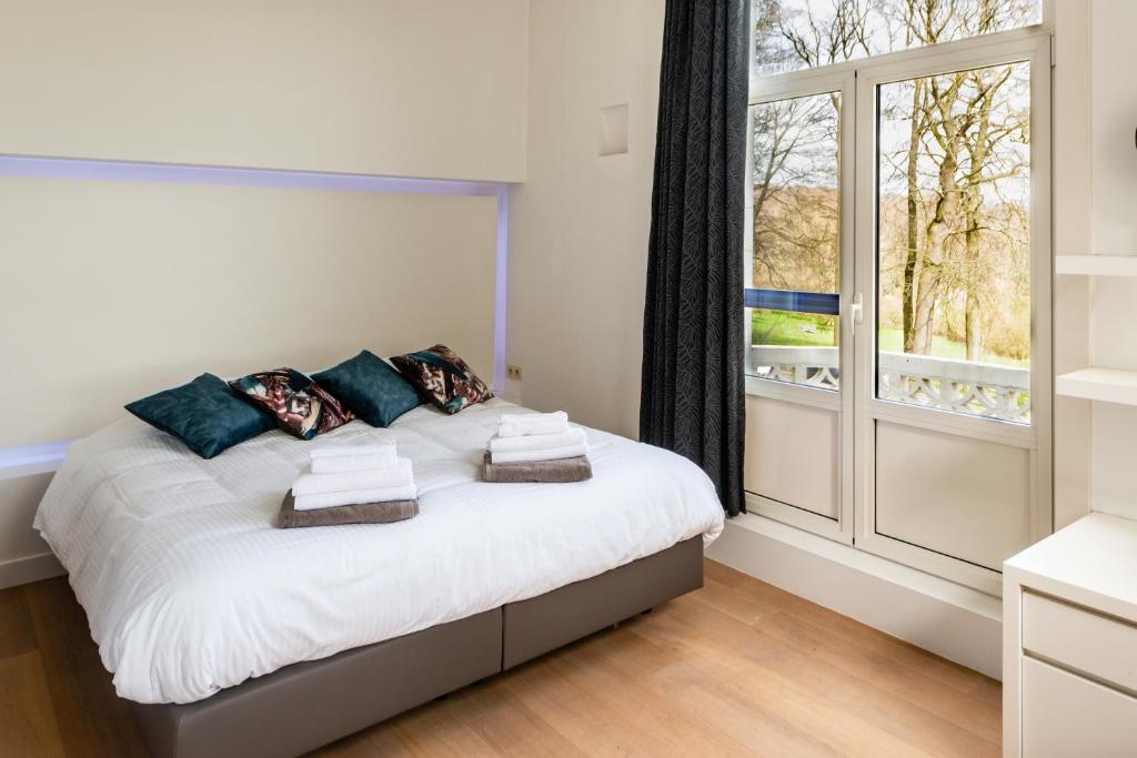Postel nebo postele na pokoji v ubytování Boeckhaege vakantiewoning