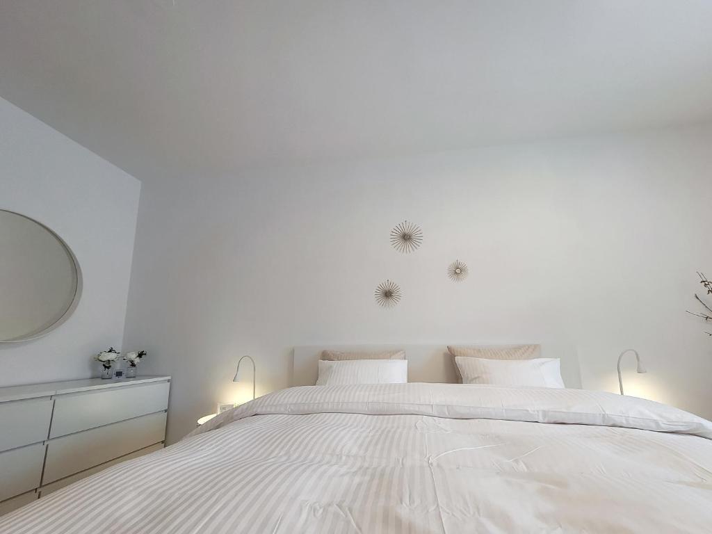 Postel nebo postele na pokoji v ubytování Apartments Julian Experience