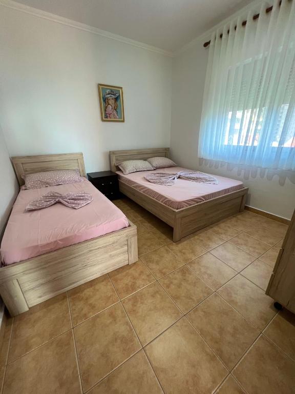 Postel nebo postele na pokoji v ubytování Apartment Kune,Shëngjin