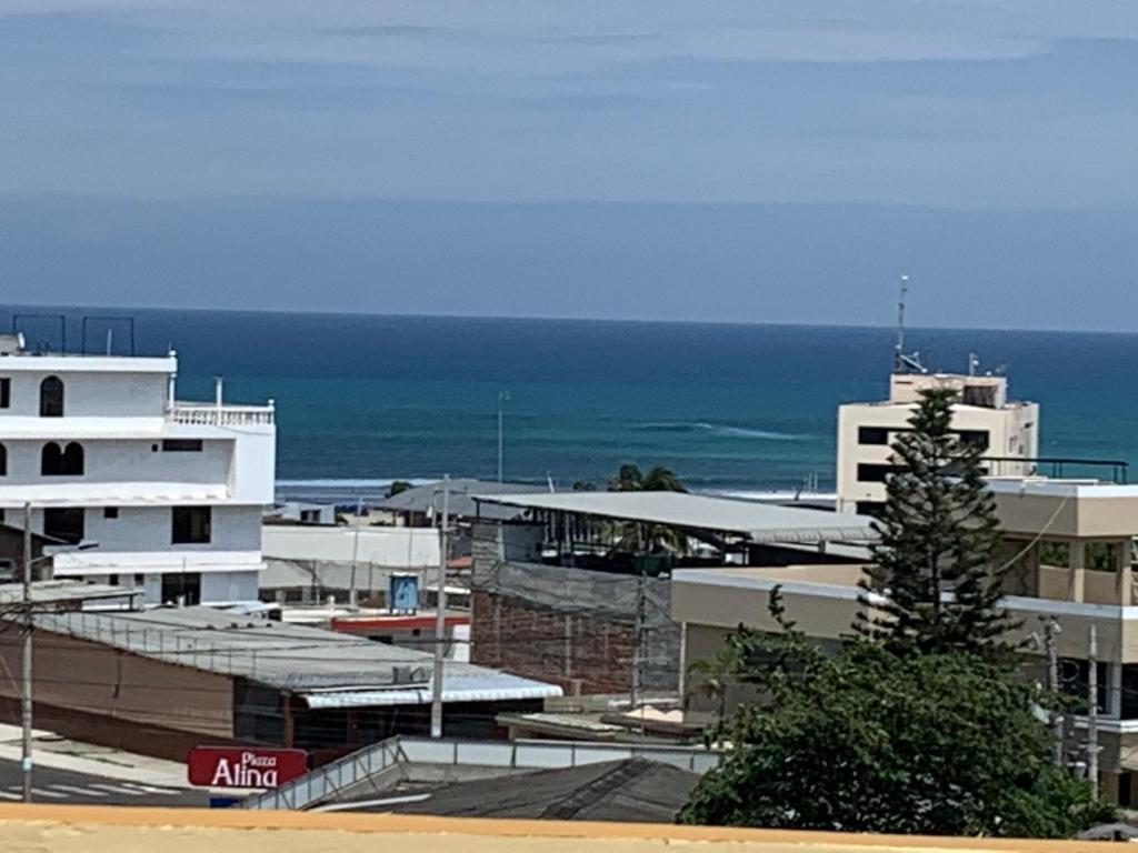 a view of a city with the ocean in the background at Flavio Reyes in Manta