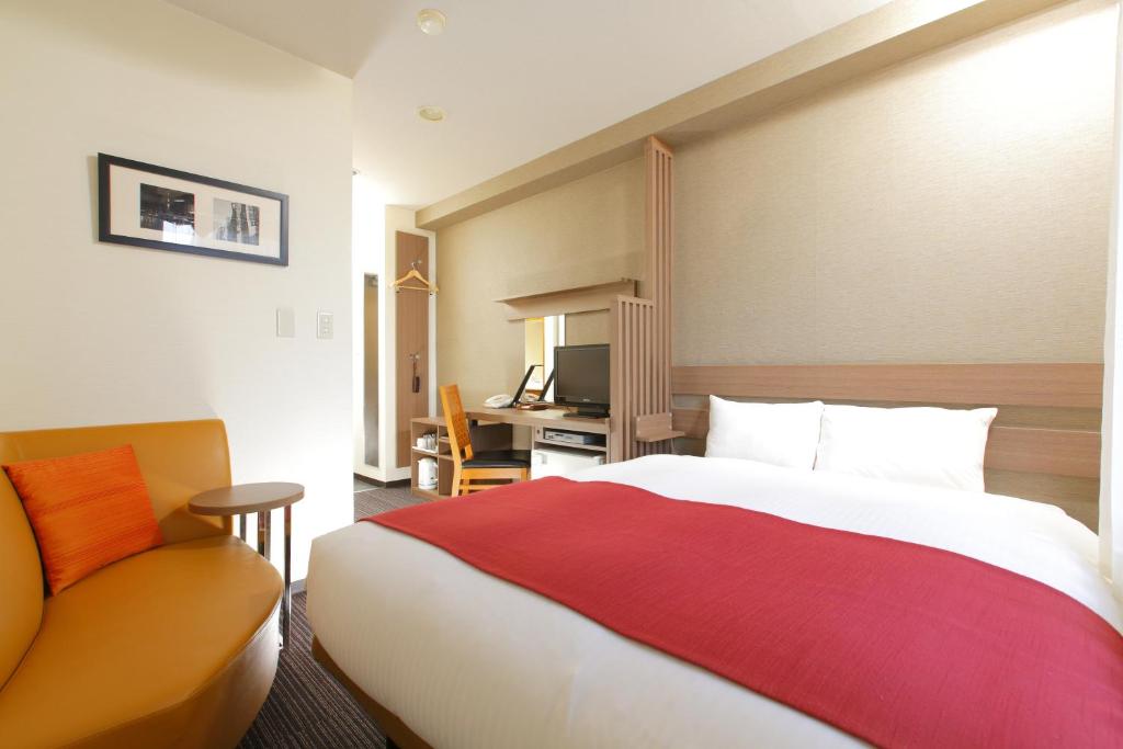 Postel nebo postele na pokoji v ubytování HOTEL MYSTAYS Kameido