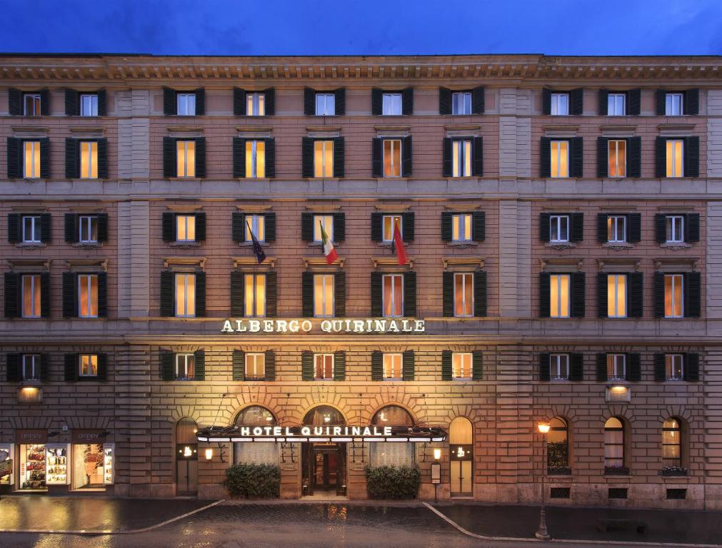 a building with a sign on the front of it at Hotel Quirinale in Rome