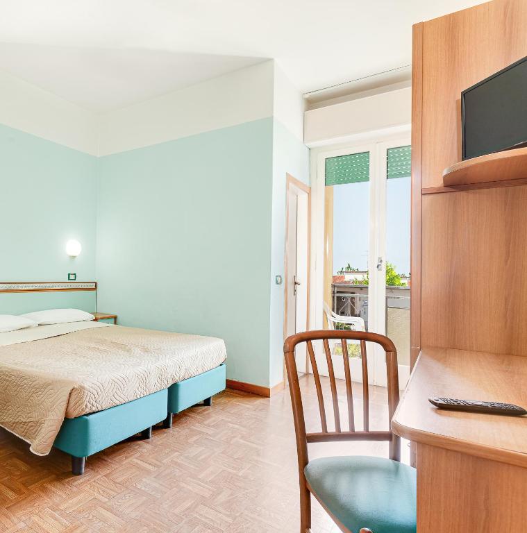 Postel nebo postele na pokoji v ubytování Hotel Fantini