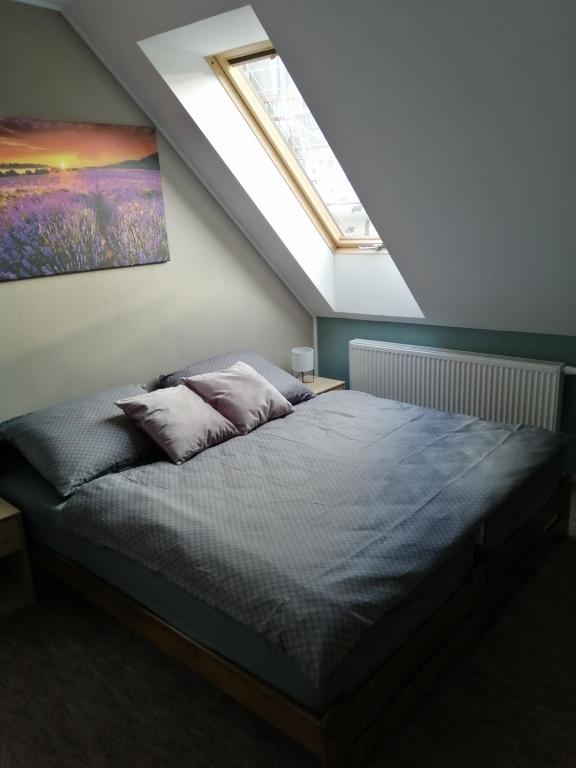 Postel nebo postele na pokoji v ubytování APARTMÁNY PIETRO
