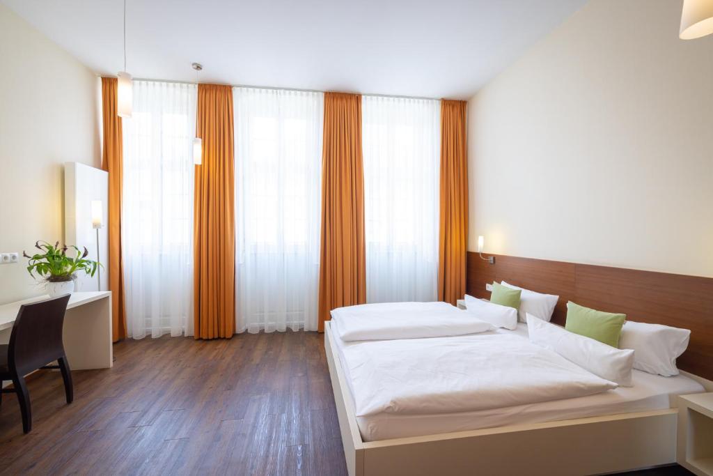 Postel nebo postele na pokoji v ubytování Altstadthof Freinsheim