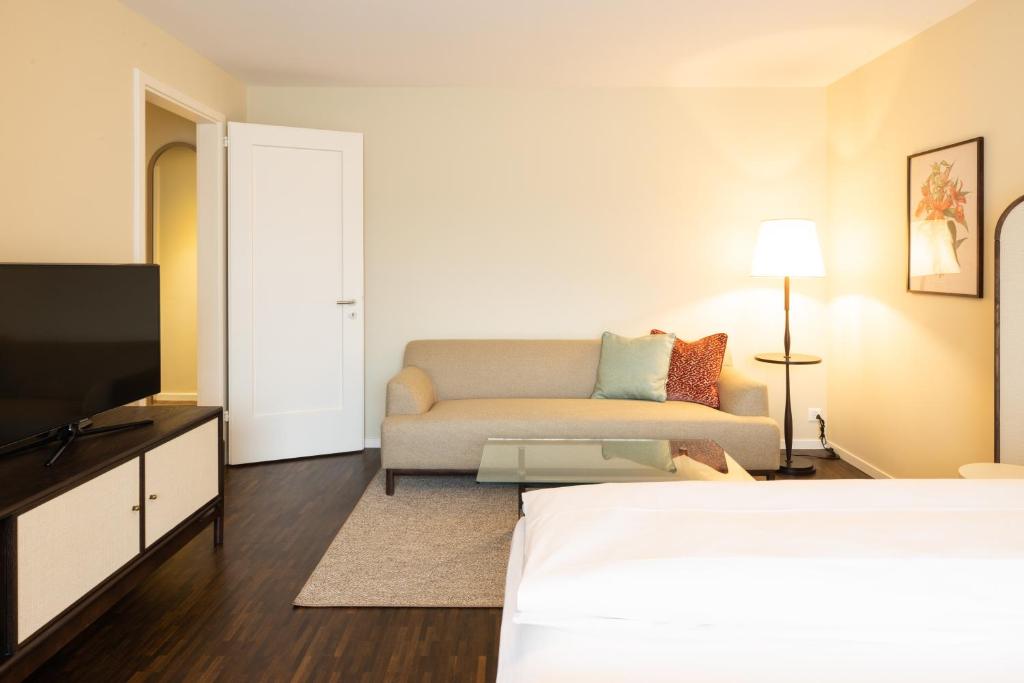 Postel nebo postele na pokoji v ubytování EMA House Serviced Apartments Superior Seefeld