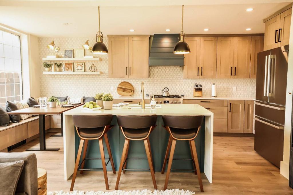 a kitchen with a large island with bar stools at Northstar 18 in Telluride